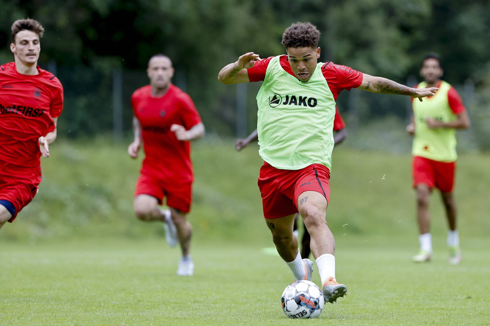 Manuel Benson during a Royal Antwerp training session, showcasing his technique as he prepares for a possible transfer to Leeds United.