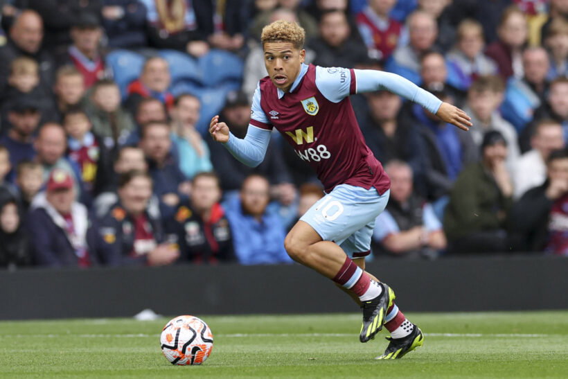 Burnley winger Manuel Benson sprints down the wing during a match.