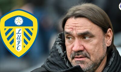 Leeds United manager Daniel Farke looking at the Leeds badge.