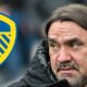 Leeds United manager Daniel Farke looking at the Leeds badge.